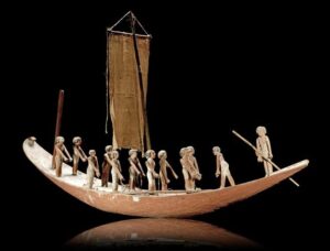 An Egyptian Middle Kingdom, c.2133-1797BC, gesso-painted wood model boat
