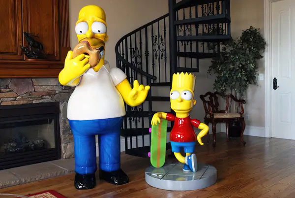 Large 3D character model of homer Simpson with doughnut and bart with skateboard