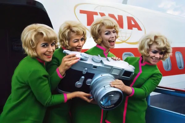 Large Product Replica of flight attendants holding a large camera