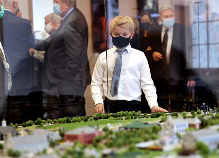 Child looking at the this is the place monument park diorama