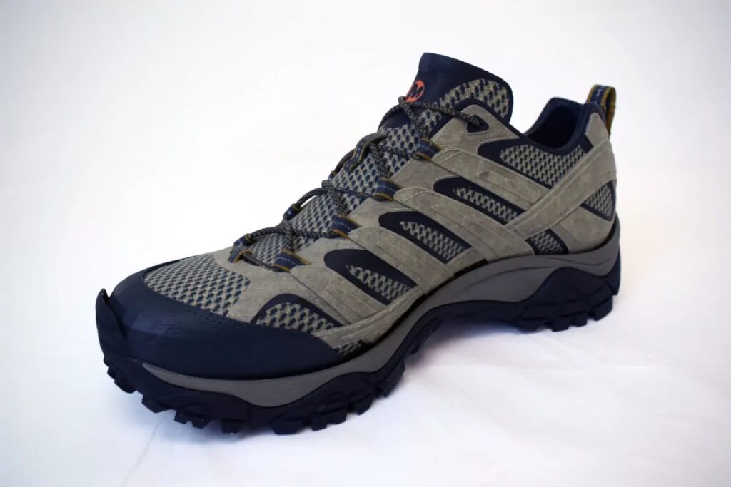 Detailed hiking shoe replica model showing tread, laces, panels, and surface textures