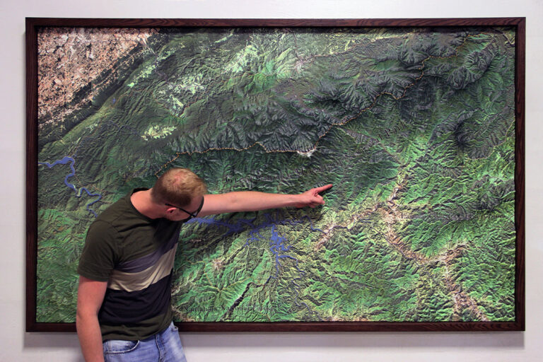 Person pointing to a Topographical Model of Great Smoky Mountains National Park