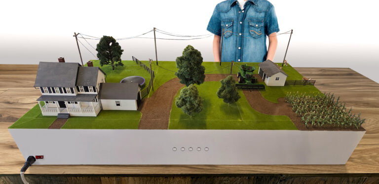 Custom diorama shows a rural Texas cattle farm and nearby cotton field.