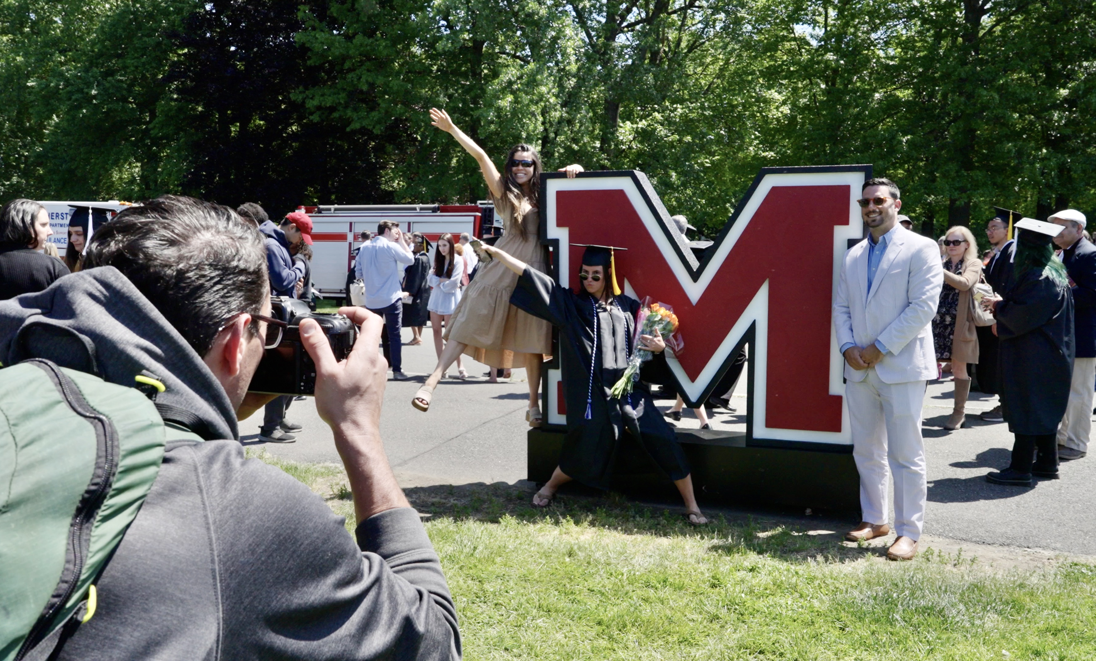 Umass Amherst graduation logo photo background large letters