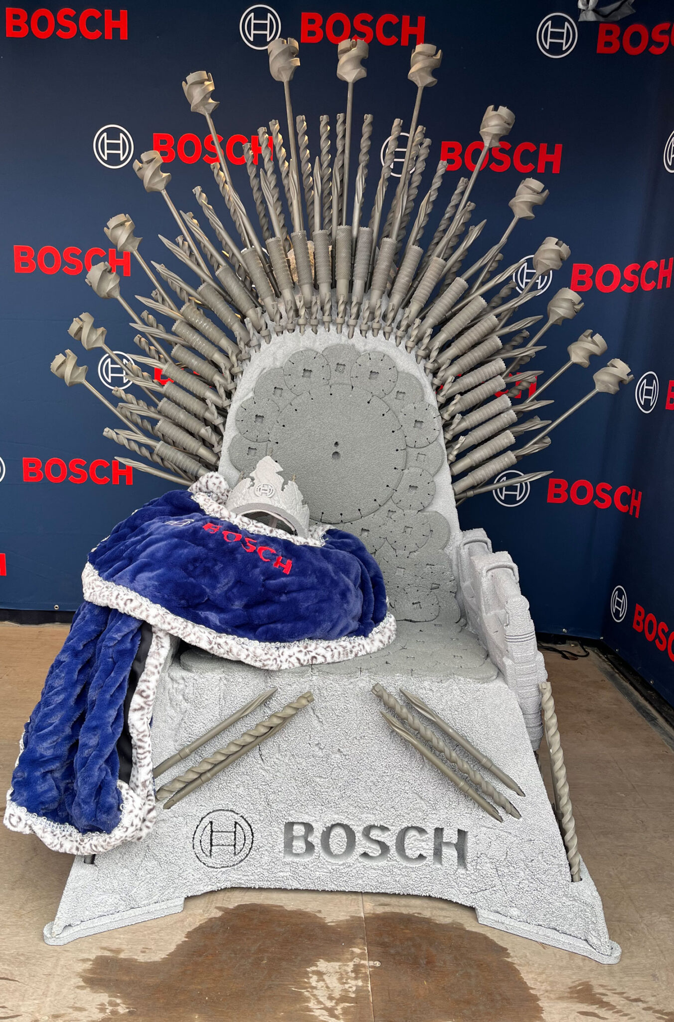 Bosch throne display with crown, cape, and scepter