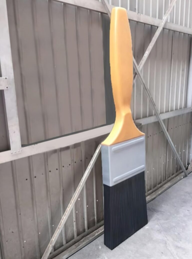 Tall giant paint brush prop displayed upright