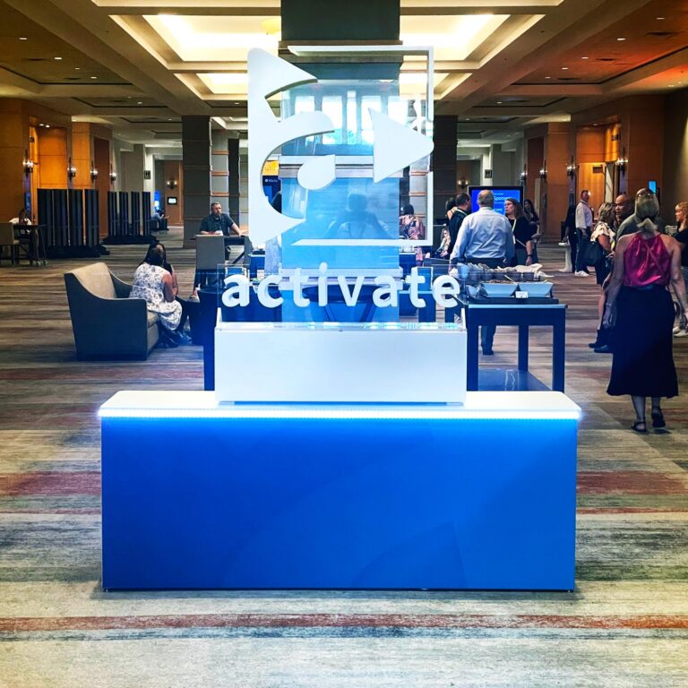 Activate large floating 3D logo display with LED lighting for a special event lobby