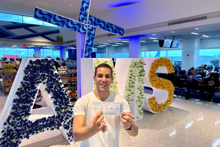 JetBlue Amsterdam route giant foam letters and working windmill display at JFK Airport.