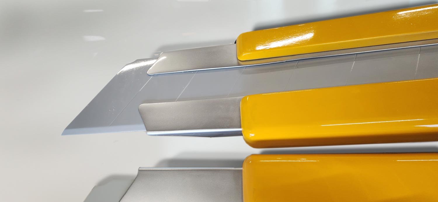 Close view of the blade and handle on a giant box cutter replica