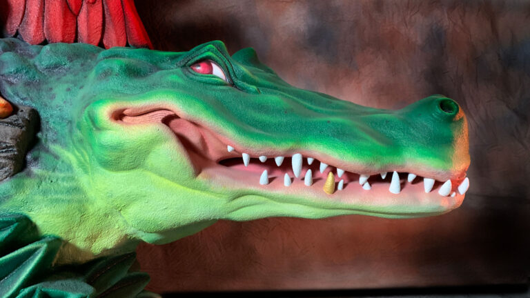 Disney Animal Kingdom Rainforest Cafe sign Crocodile closeup