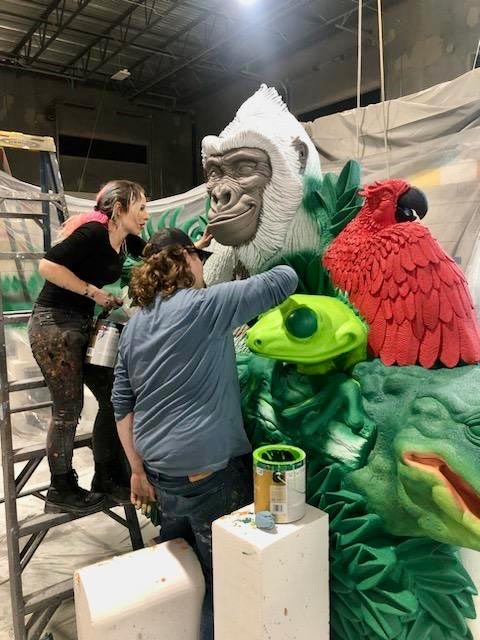 Hand-painting the first layers of color for the Rainforest Cafe sign