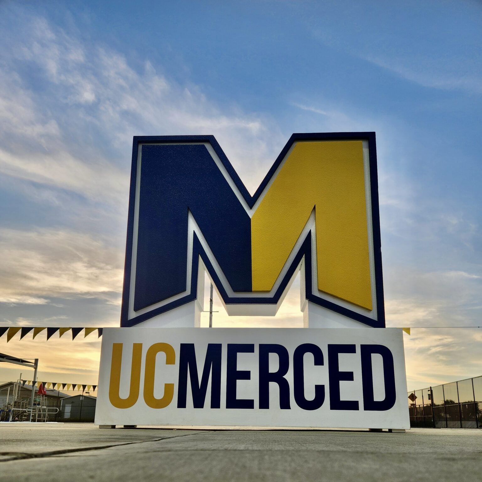 UC Merced Dimensional Logo WhiteClouds