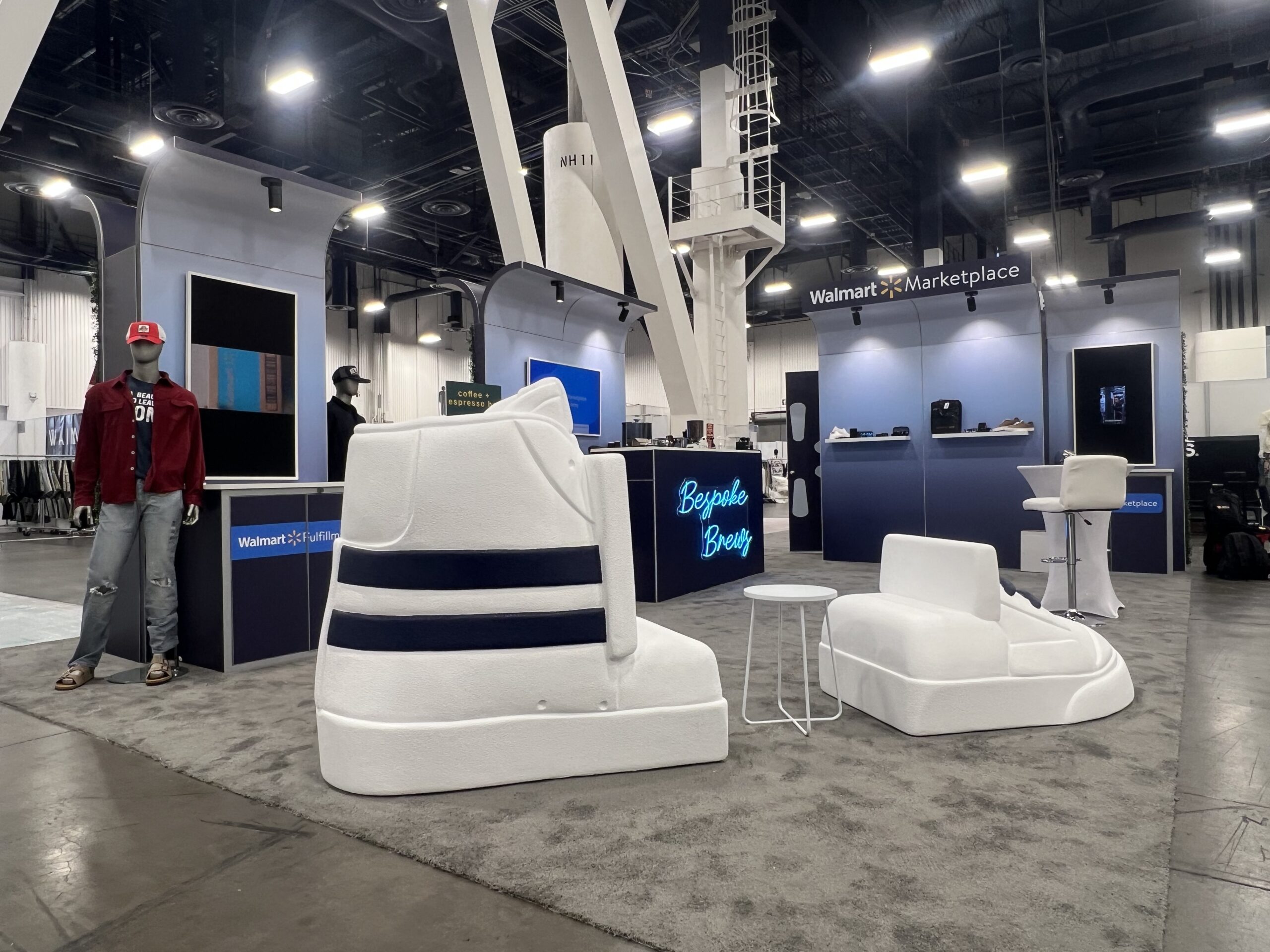 White high-top shoe couch props at a Walmart Marketplace expo booth
