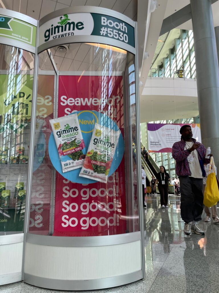 Oversized replicas of Gimme Seaweed snack packages were prominently showcased at a recent event, capturing the attention of attendees.