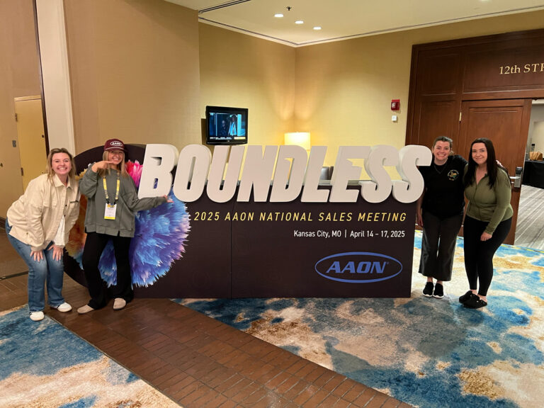 Illuminated logo display fabricated for a National Sales Meeting expo setup.