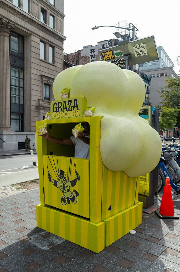 Custom 8-foot-tall Graza Popcorn sampling booth built for a street marketing campaign display.