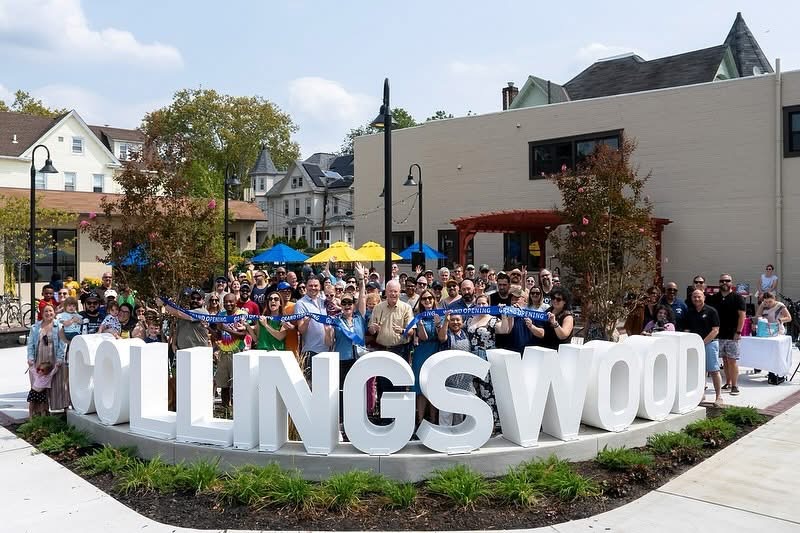 White COLLINGSWOOD dimensional metal letters in a landscaped public gathering space