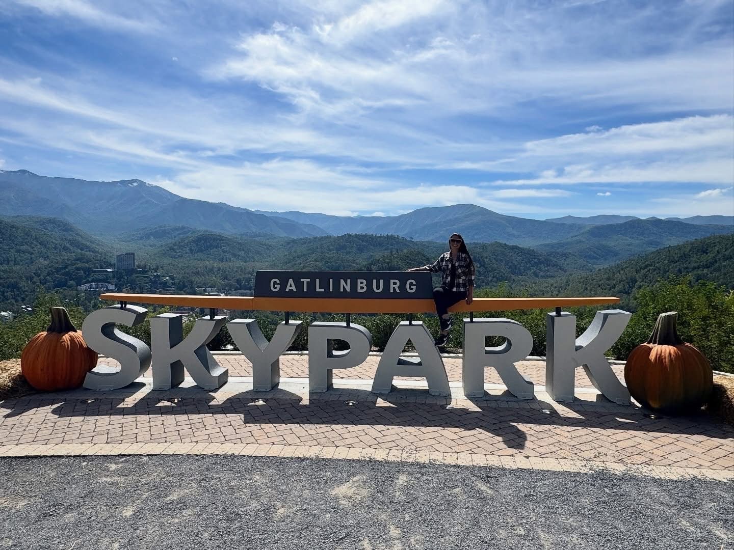Wide view of the Gatlinburg SkyPark logo against the Great Smoky Mountains