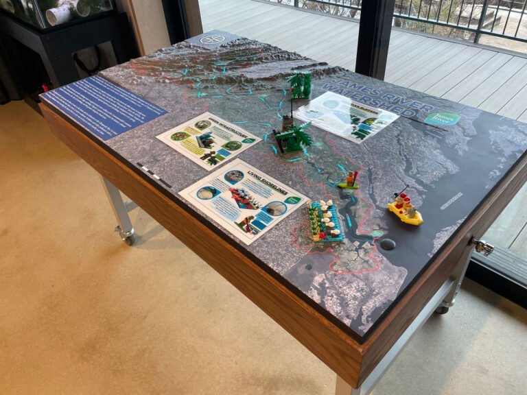 Custom interactive 3D watershed model created for the James River Association, featuring detailed terrain, animated illuminated LED lighting that shows river flow, drainage features, and student LEGO Build the Change models.