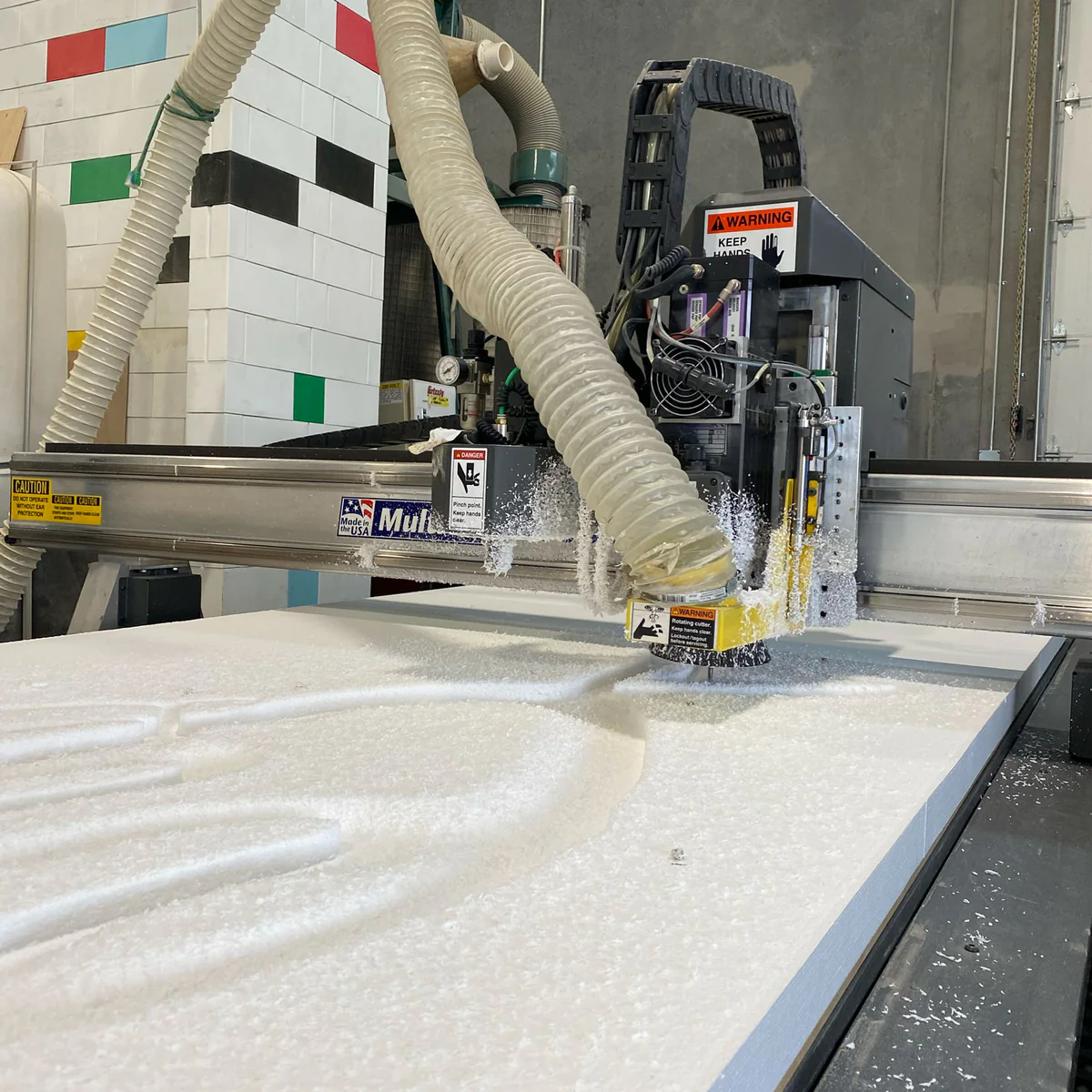 CNC machine carving foam.