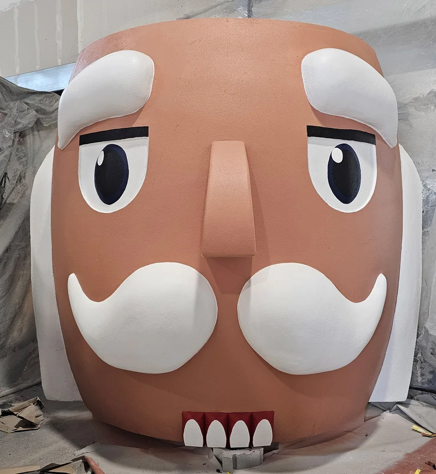 Painted face and head of the giant Luverne nutcracker inside the WhiteClouds facility
