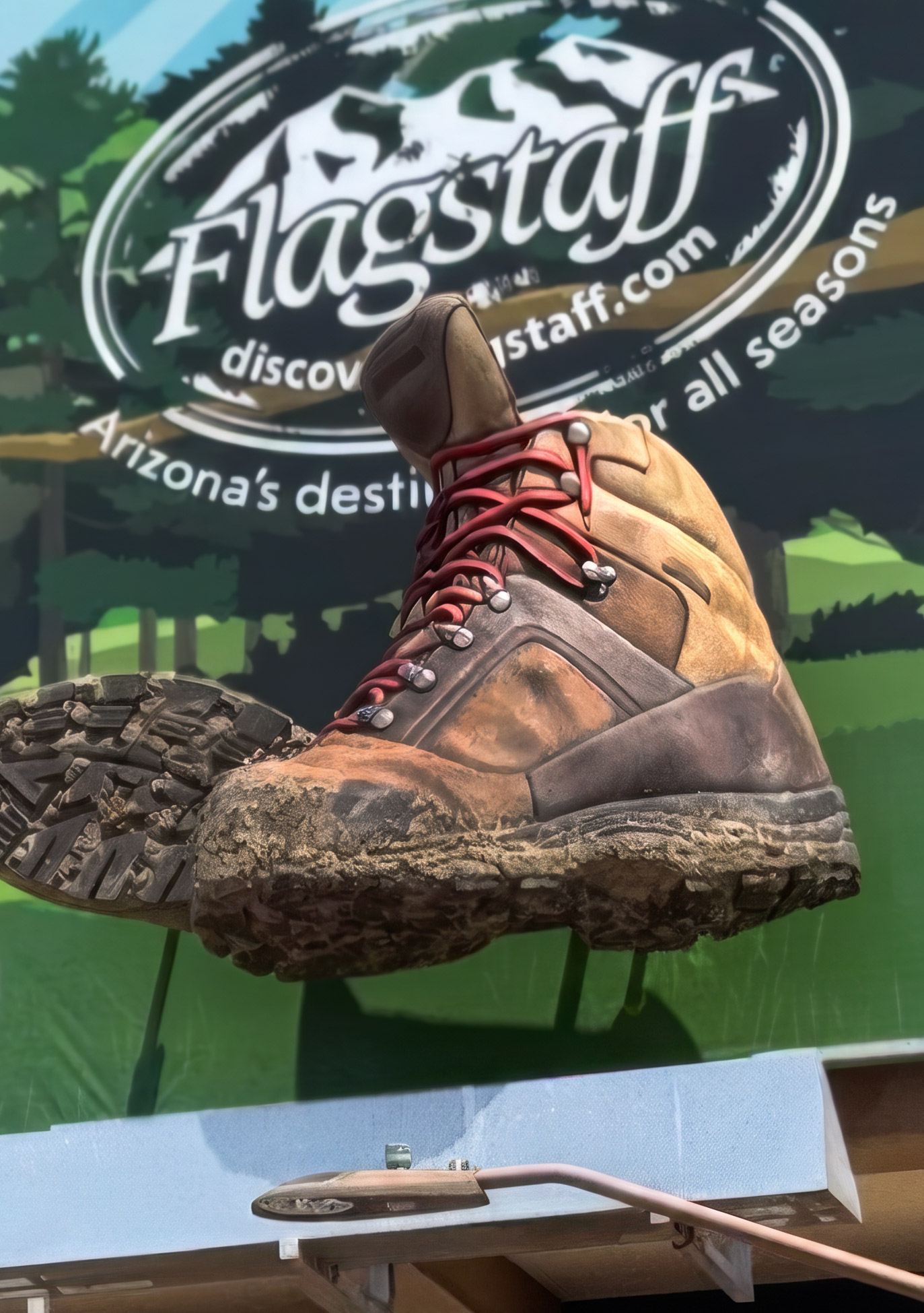 Muddy giant hiking boot relief props fabricated for an outdoor 3D billboard.