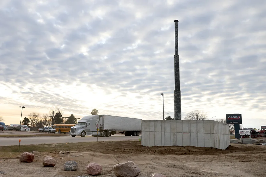 Concrete base and support pole prepared for the giant nutcracker installation in Luverne
