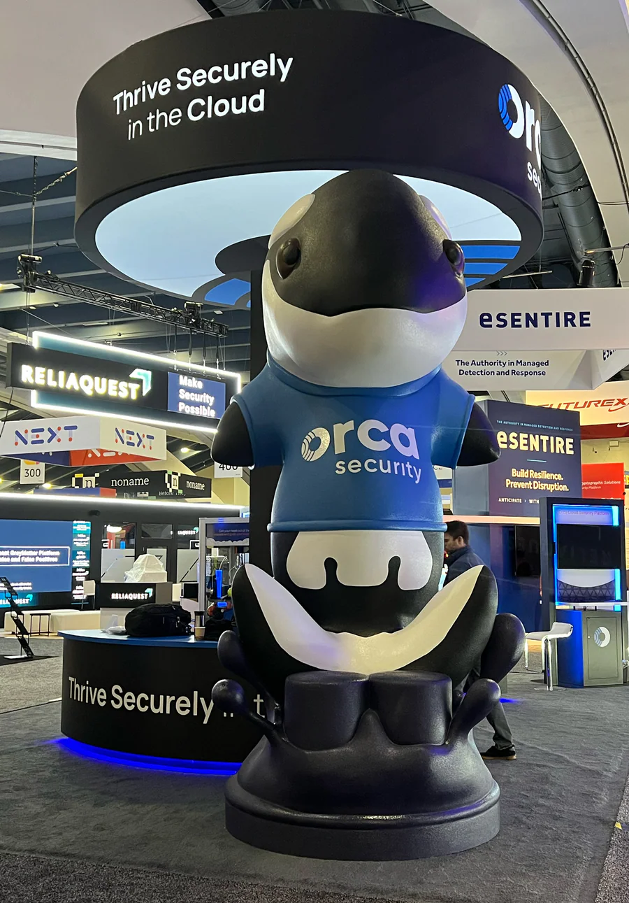 Completed orca mascot foam sculpture displayed at an event.