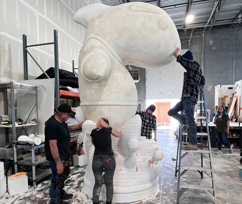Applying skim filler coat on a prepared foam prop.