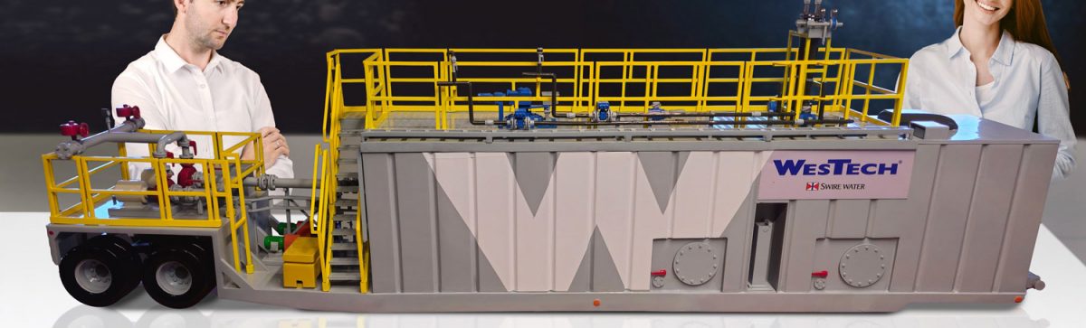 This miniature industrial model of a water treatment trailer is 5 feet long and features a cutaway section on one side.